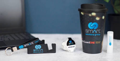 Branded travel mug, lip balm, keyring, tablet stand, and mints